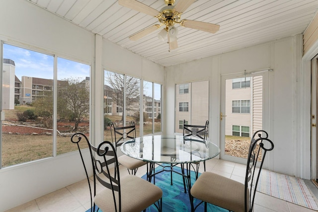 sunroom with wooden ceiling and ceiling fan