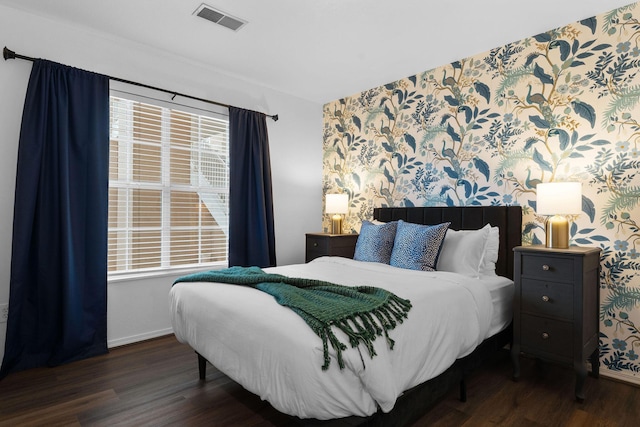 bedroom featuring dark hardwood / wood-style floors