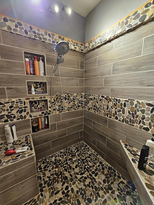 bathroom featuring tiled shower