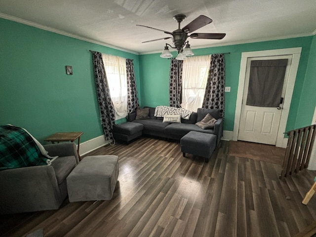 living room with ornamental molding, dark hardwood / wood-style floors, and ceiling fan