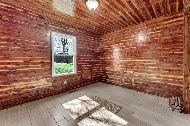 empty room featuring wood ceiling