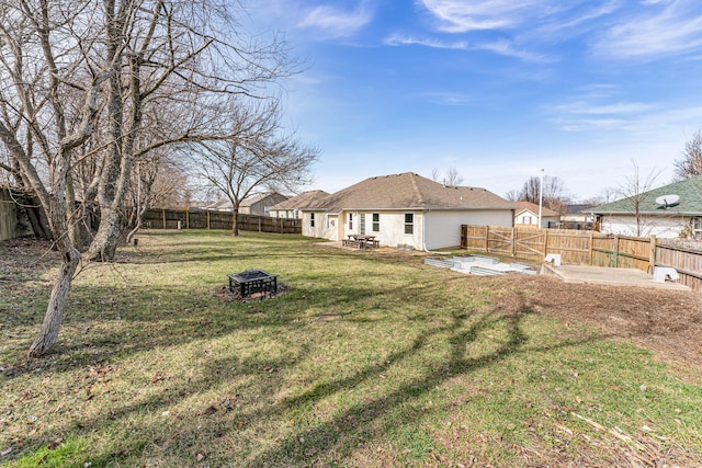 view of yard with a patio area and a fire pit