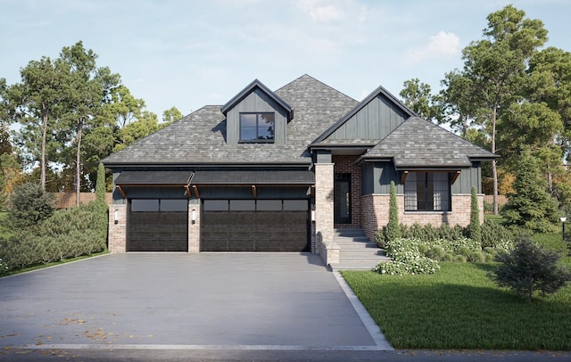 view of front facade with a garage and a front yard