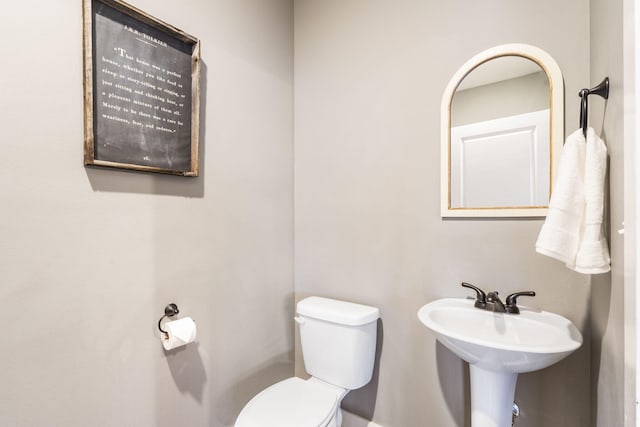 bathroom with sink and toilet