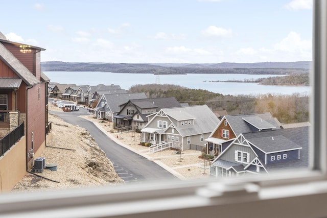 bird's eye view with a water and mountain view