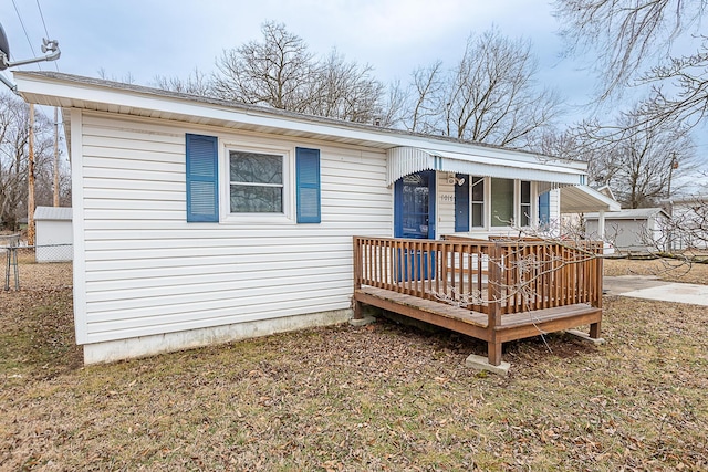 exterior space with a yard and a deck