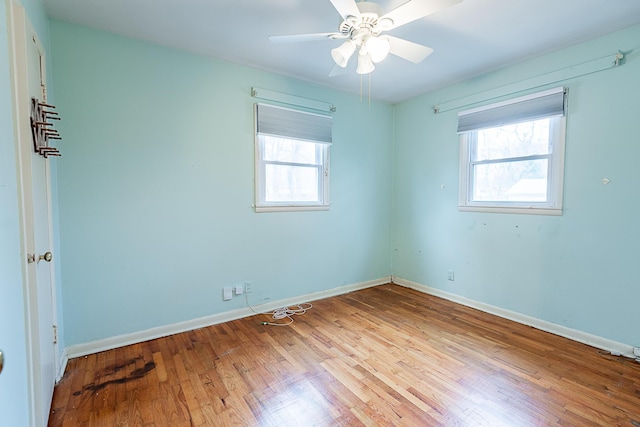 spare room with light hardwood / wood-style floors and ceiling fan