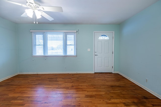 foyer entrance with dark wood-type flooring and ceiling fan