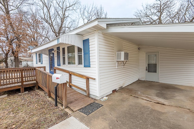 view of side of property featuring a carport