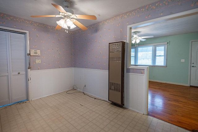 unfurnished room with ceiling fan