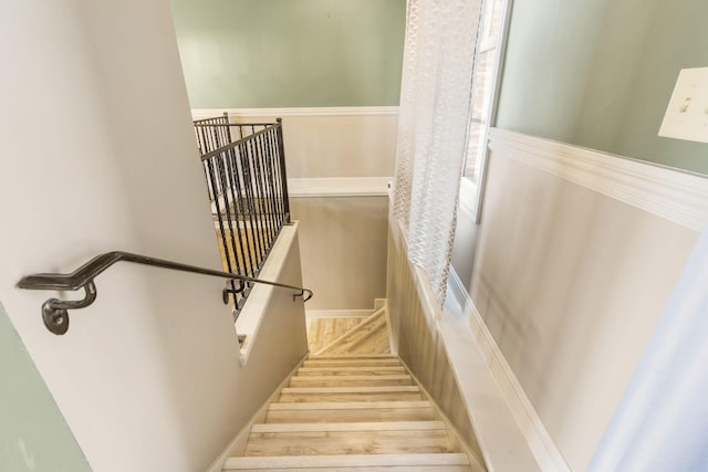 stairway with wood-type flooring