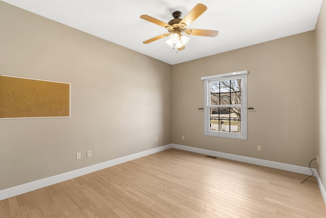 spare room featuring ceiling fan and light wood-type flooring