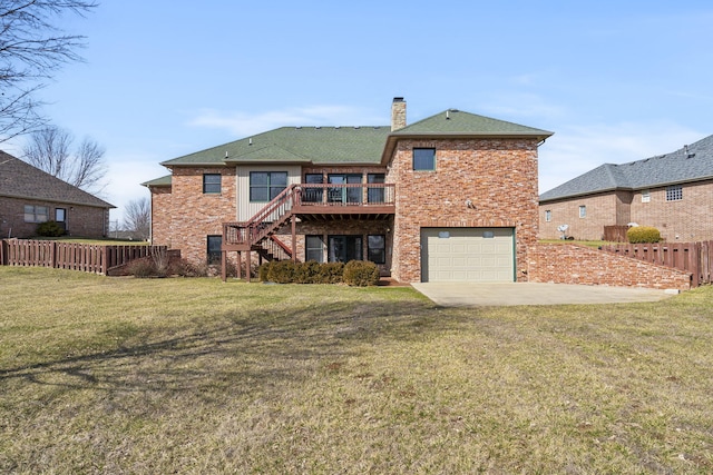 back of house with a garage, a patio, a yard, and a deck