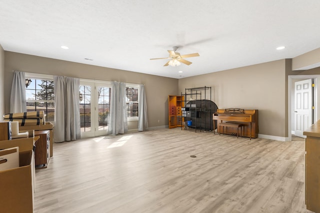 sitting room featuring ceiling fan and light hardwood / wood-style floors