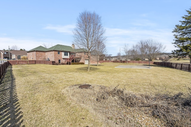 view of yard featuring basketball court