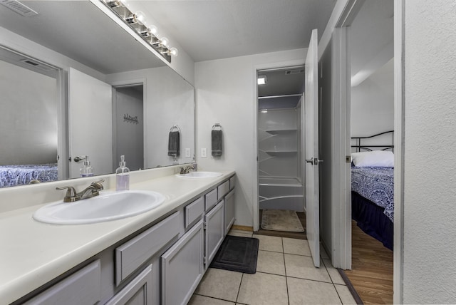 bathroom with vanity and tile patterned floors