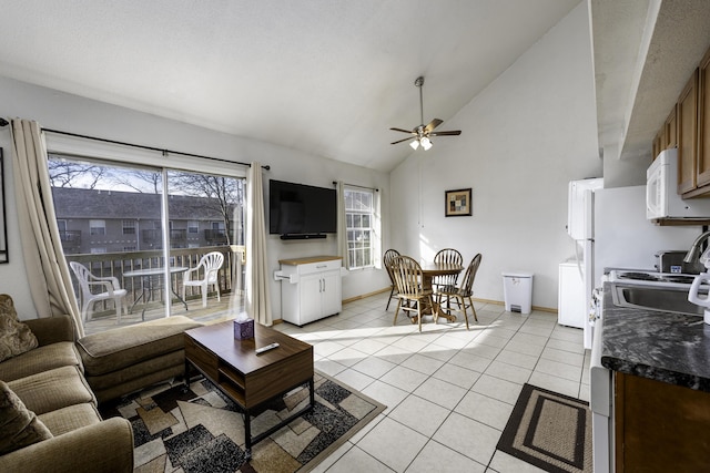 living room with light tile patterned floors, high vaulted ceiling, and ceiling fan