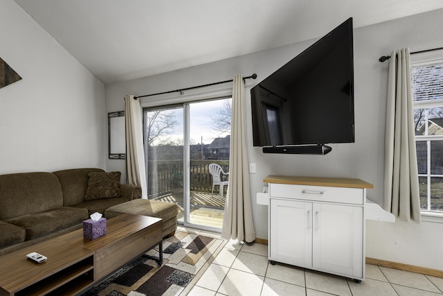 tiled living room featuring lofted ceiling