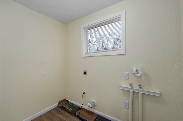 laundry room featuring electric dryer hookup, hookup for a washing machine, and wood-type flooring