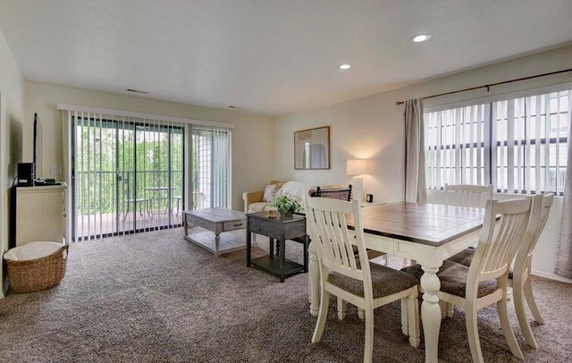 view of carpeted dining area