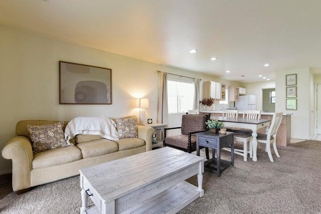 living room with light colored carpet