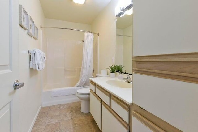 full bathroom featuring vanity, shower / tub combo with curtain, and toilet