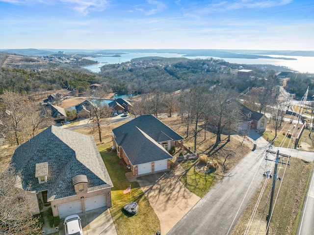 drone / aerial view with a water view