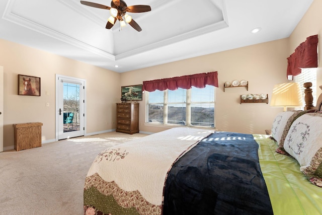 bedroom featuring access to outside, light colored carpet, a raised ceiling, and ceiling fan