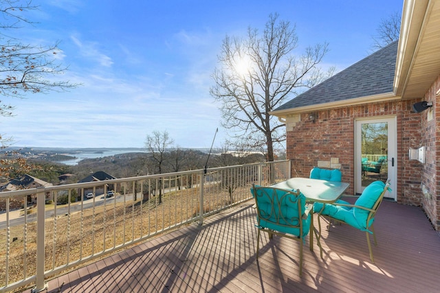 wooden deck featuring a water view