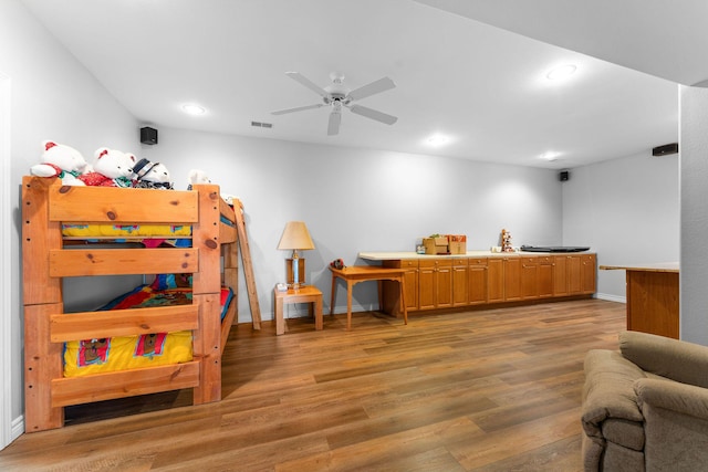 bedroom featuring hardwood / wood-style flooring and ceiling fan