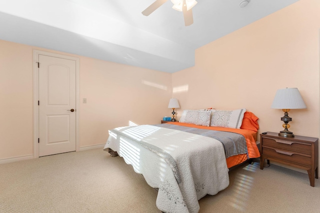 bedroom featuring light colored carpet and ceiling fan