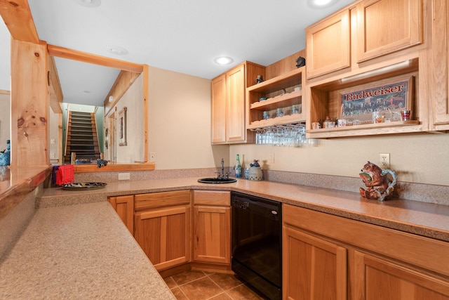 kitchen featuring dishwasher, sink, light brown cabinets, and light tile patterned floors