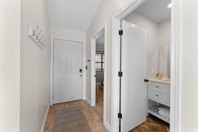 hallway with light wood-type flooring