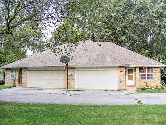 ranch-style home featuring a garage