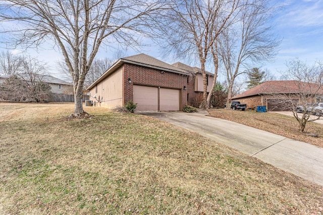 view of side of property featuring a garage and a lawn