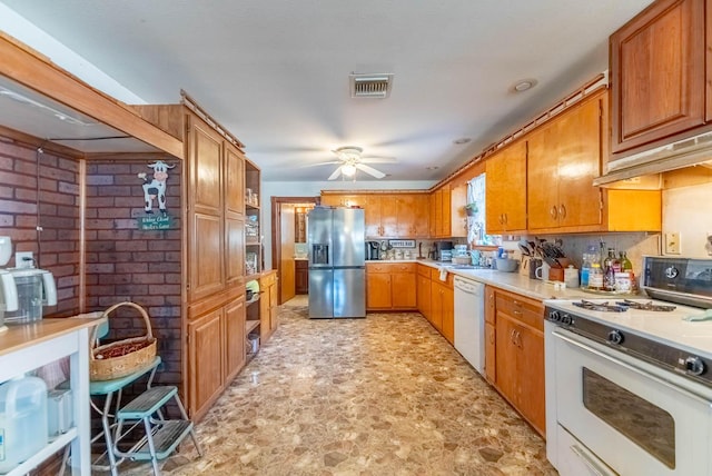 kitchen featuring ceiling fan, white appliances, and sink