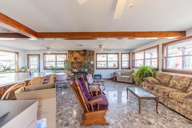 living room with ceiling fan, heating unit, and beam ceiling