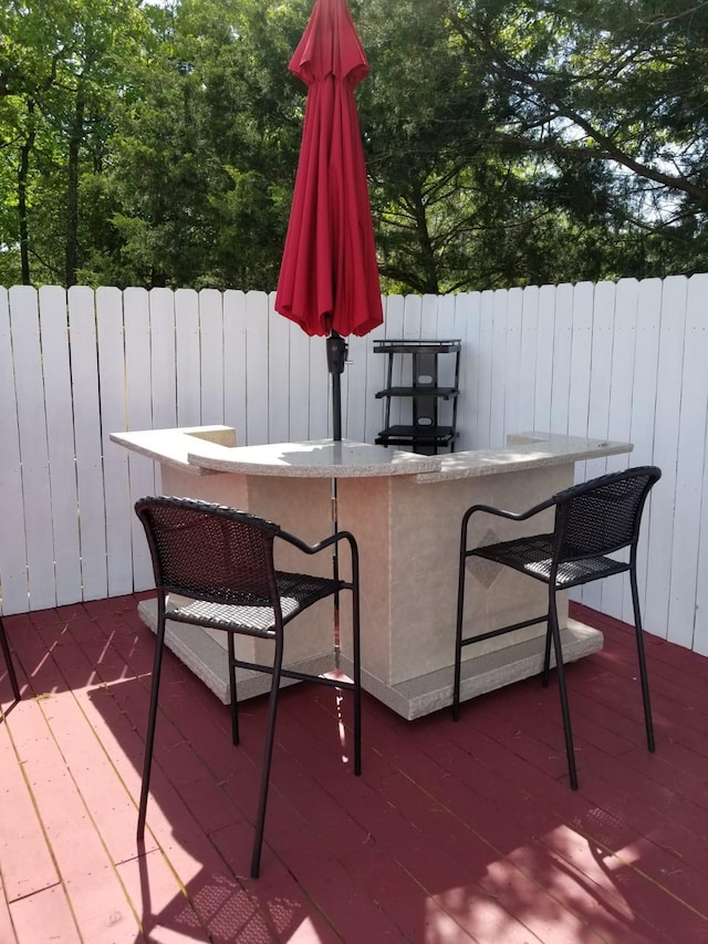 wooden terrace featuring an outdoor bar