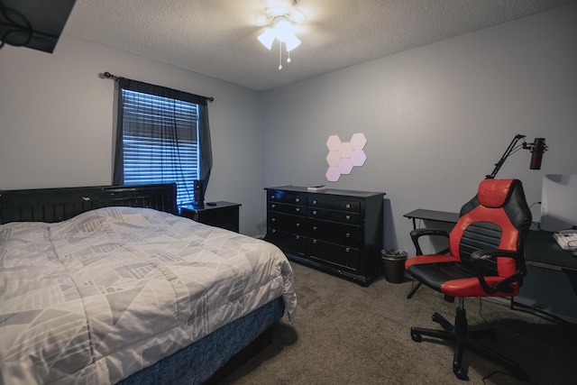 bedroom featuring carpet floors and a textured ceiling