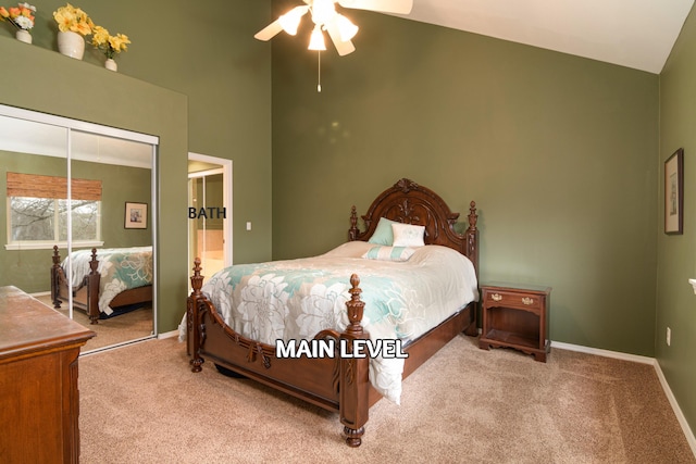 bedroom featuring vaulted ceiling, carpet floors, ceiling fan, and a closet