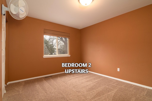 unfurnished room featuring carpet flooring