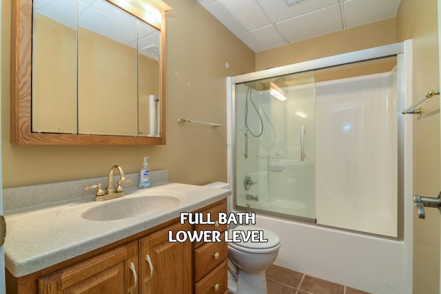 full bathroom with enclosed tub / shower combo, vanity, toilet, and tile patterned flooring