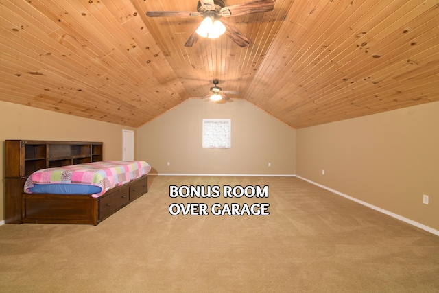 carpeted bedroom with vaulted ceiling, wooden ceiling, and ceiling fan