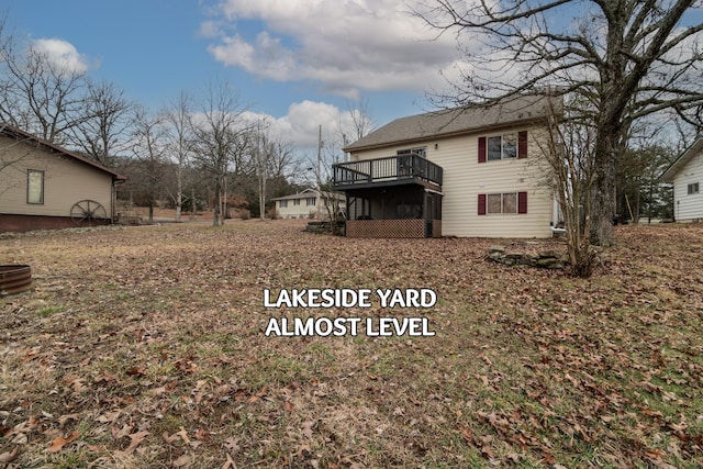 view of yard with a wooden deck