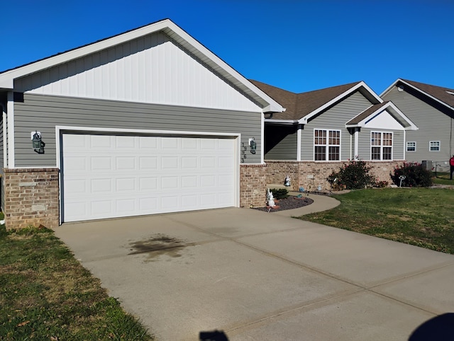 craftsman-style home featuring a garage and a front yard