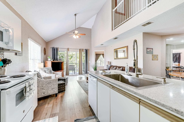 kitchen featuring sink, white appliances, ceiling fan, light hardwood / wood-style floors, and white cabinets