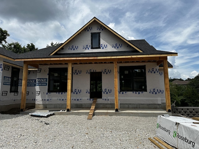 654 Walkington Ln, Branson, MO 65616 - unfinished property with a porch and a shingled roof