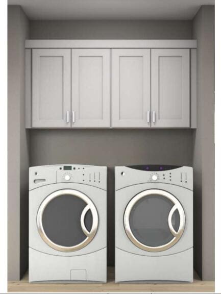 washroom featuring cabinets and independent washer and dryer