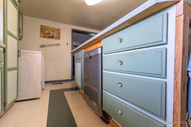 clothes washing area featuring washer / dryer