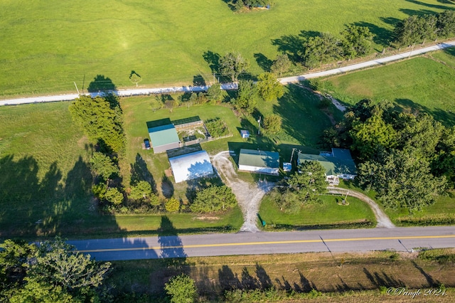 birds eye view of property with a rural view